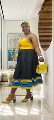 Midi A-line dress, yellow halter bodice with black skirt and blue stripe band hem.