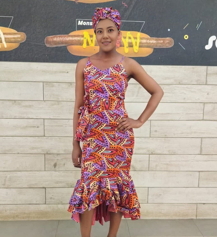 Geometric midi dress with ruffle hem, sleeveless, colorful patterned fabric