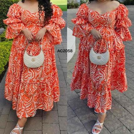 Orange-red printed maxi dress with puff flounce sleeves and tiered skirt