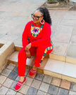 African print twin set, red long-sleeve top and matching pants with colorful neckline trim