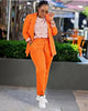 Orange twin set blazer and trousers with drawstring waist