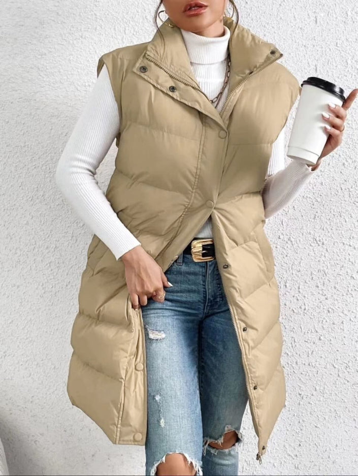 Cream sleeveless puffer vest with high collar, button front and side pockets