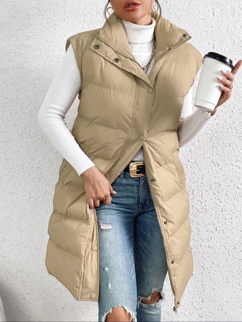 Cream sleeveless puffer vest with high collar, button front and side pockets