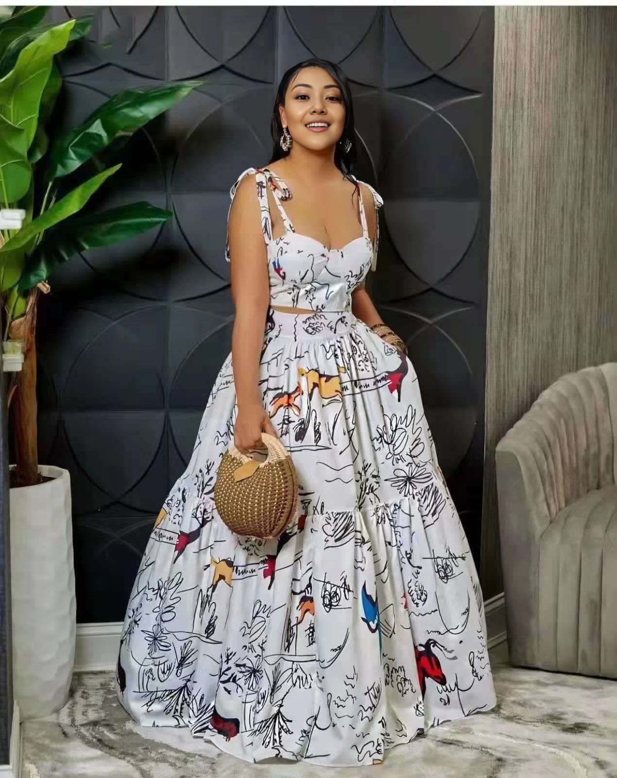 White maxi dress with abstract animal print, spaghetti straps, gathered skirt