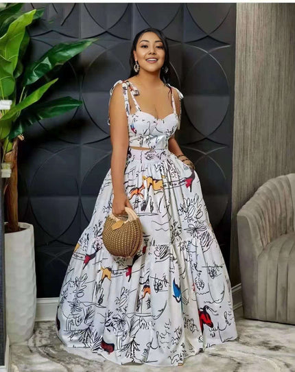White maxi dress with abstract animal print, spaghetti straps, gathered skirt