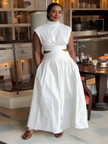 White sleeveless high-neck midi dress with waist cut-out, flared A-line skirt