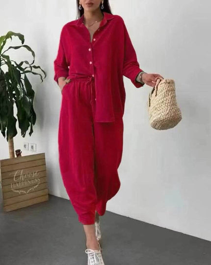 Red loose-fit button-up shirt and drawstring trouser set with rolled sleeves
