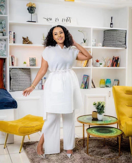 White pleated twin set top with adjustable waist and matching wide-leg pants