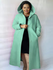 Knee-length hooded coat in mint blue with button front, long sleeves, and side pockets