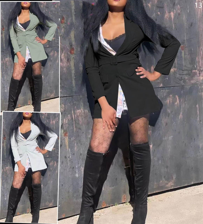 Black belted blazer dress with long sleeves, layered lapels, and short skirt hem