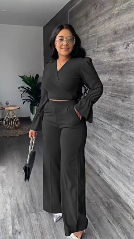 Black twin set jumpsuit with puff sleeves, V-neck, belted waist, wide-leg trousers