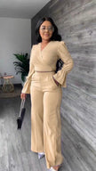 Beige V-neck puff-sleeve jumpsuit with wrap waist and wide straight legs