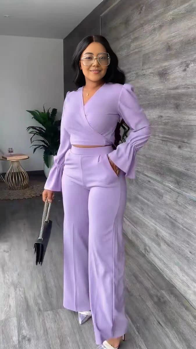 Light purple V-neck puff-sleeve jumpsuit with wrap waist and wide straight legs