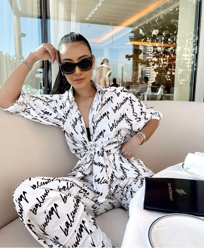 Printed casual long-sleeve jumpsuit with button front and tie waist, white base