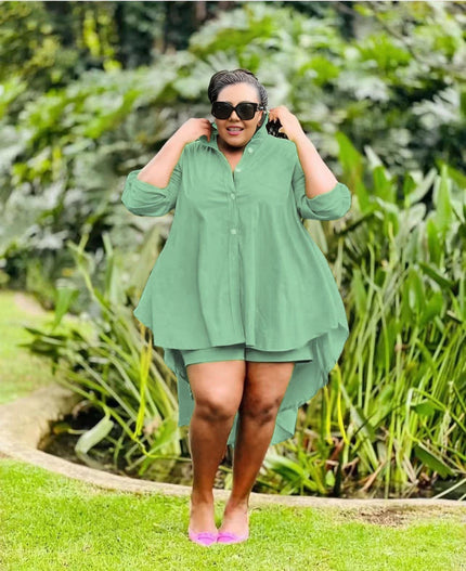 Dark-green high-low tunic with buttons and matching shorts, layered asymmetrical hem