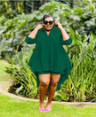 Dark green high-low tunic set with button front and matching shorts, long split sleeves