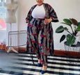 Plus size geometric print cardigan and matching pants with white crew-neck top
