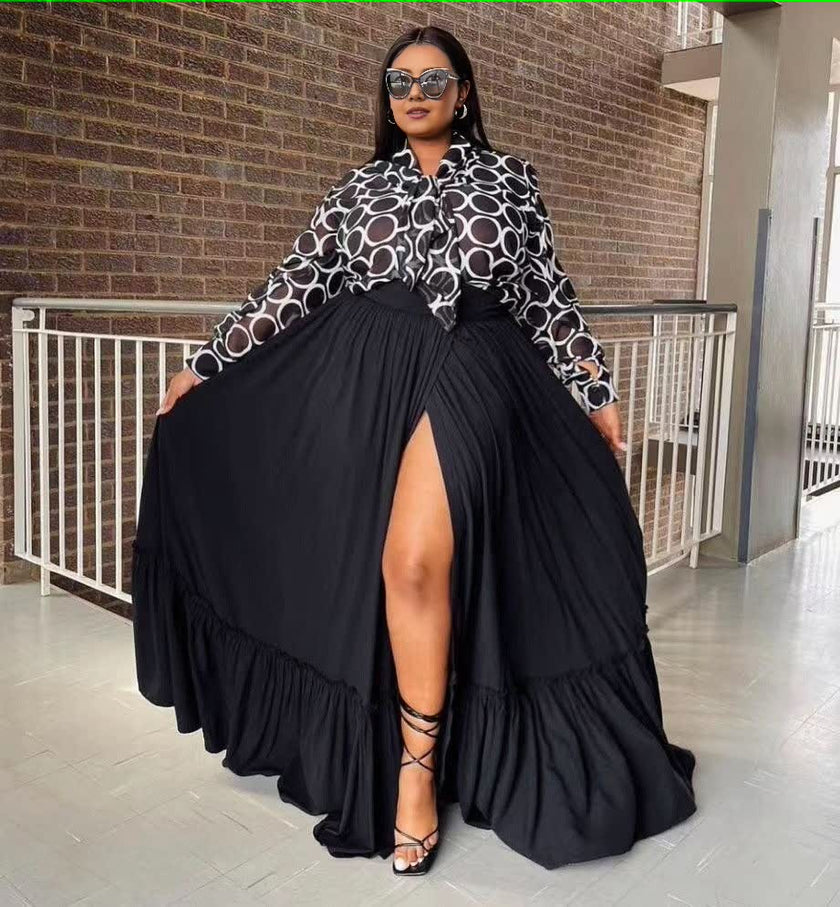 Sheer patterned blouse and black split maxi skirt, front slit detail