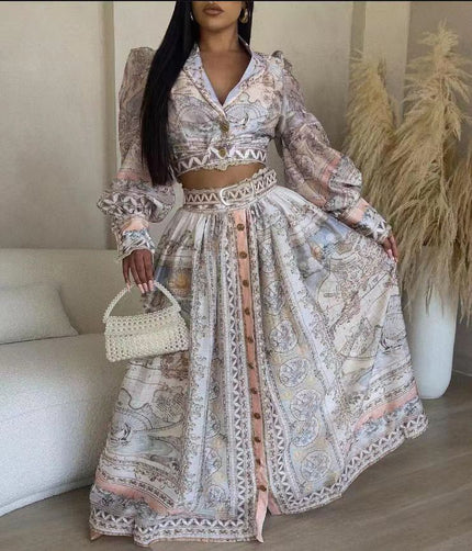 Maxi party dress with V-neck, puff sleeves, and ornate patterned skirt, lace trim