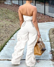 White strapless jumpsuit with ruched bodice, drawstring waist, wide-leg pants