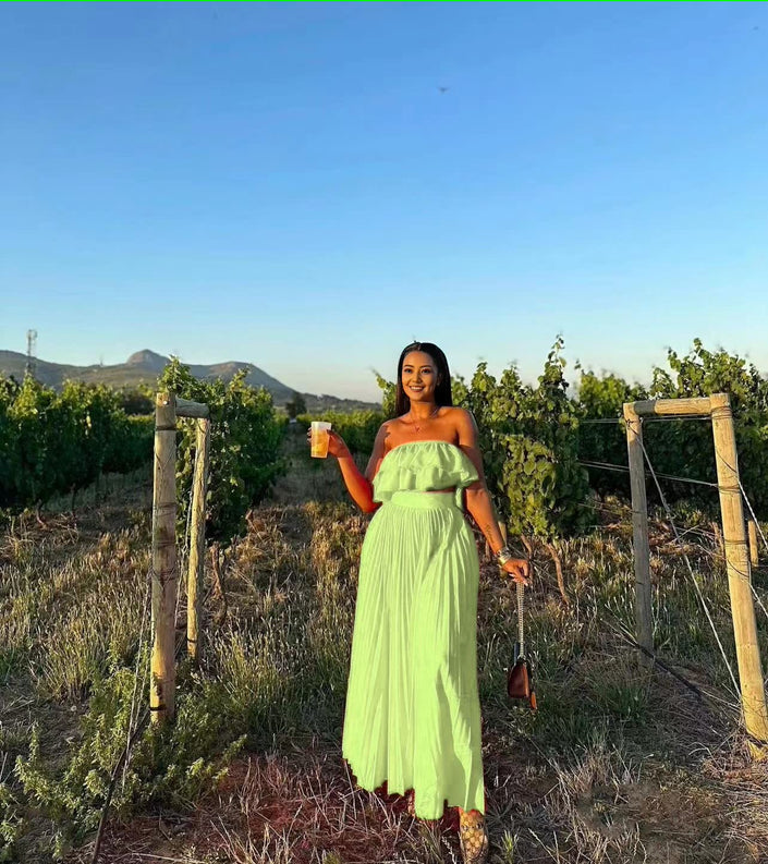 Off-shoulder light-green maxi dress with ruffle trim at bust and tiered skirt