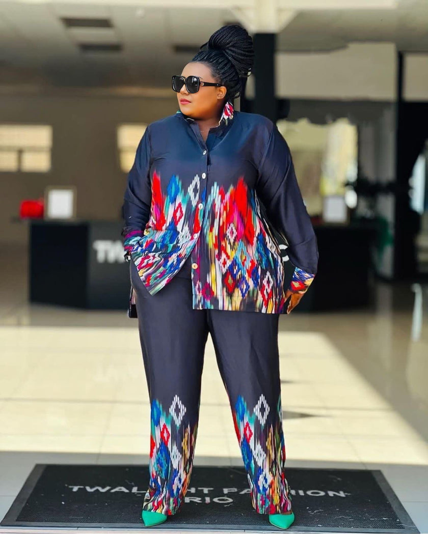 Geometric twin set: printed shirt and matching trousers, dark blue with colorful patterns