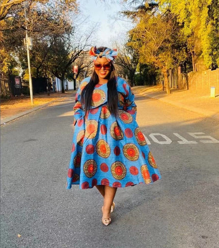 Sky-blue African print midi dress with round motif, head bow, long sleeves