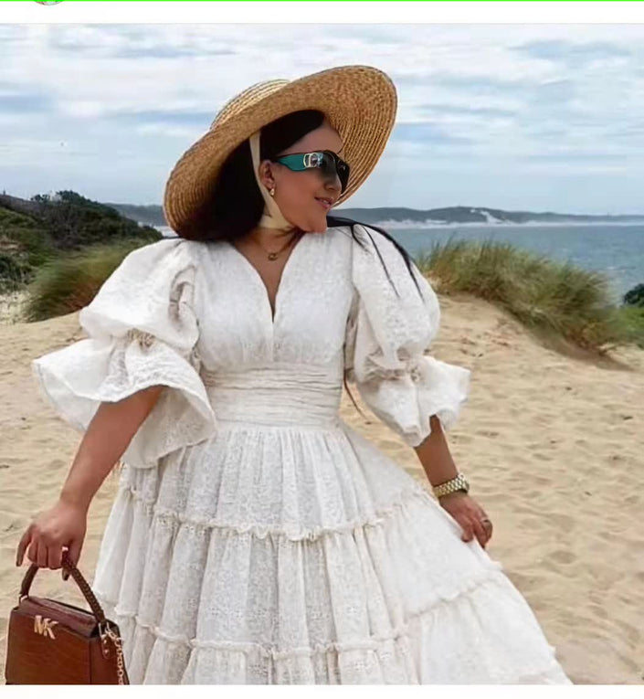 White tiered midi dress with puff sleeves and V-neck bodice