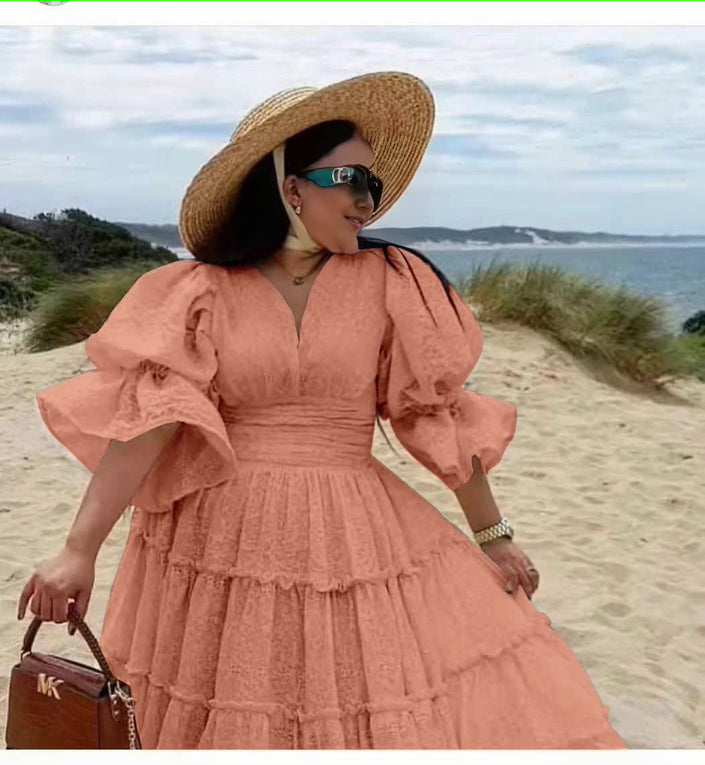 Dusty pink tiered midi dress with puff sleeves and V-neck bodice