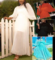 White pleated maxi dress with cinched waist and long sleeves, mock neckline