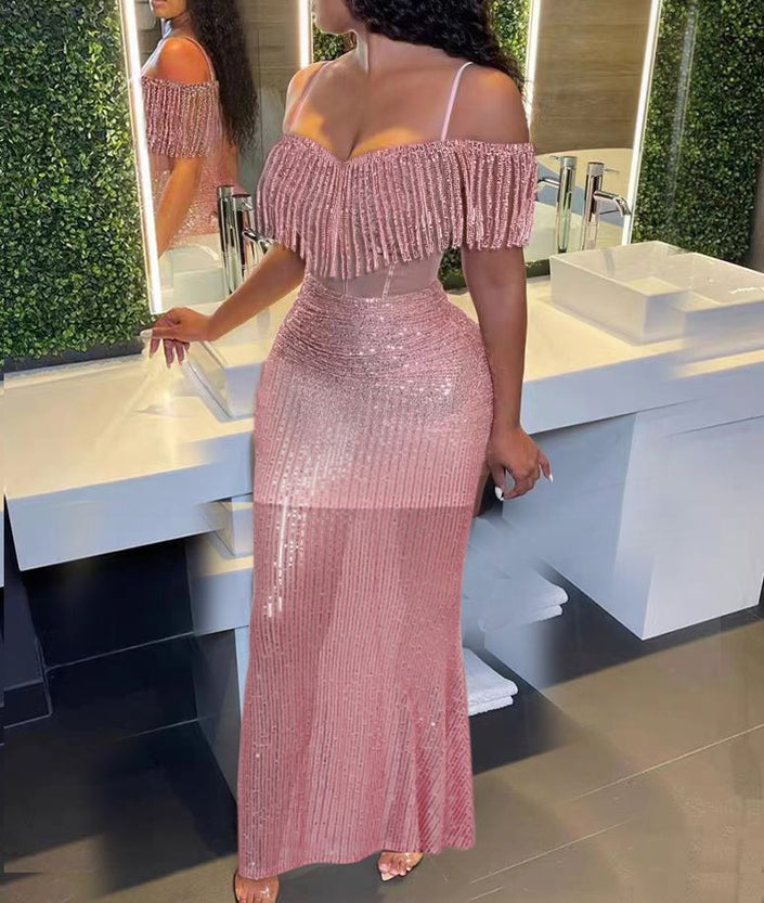 Pink mermaid maxi dress with off-shoulder sequins and fringe sleeve details, fitted flare