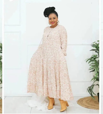 Floral tiered maxi dress, long sleeves, light peach with small print