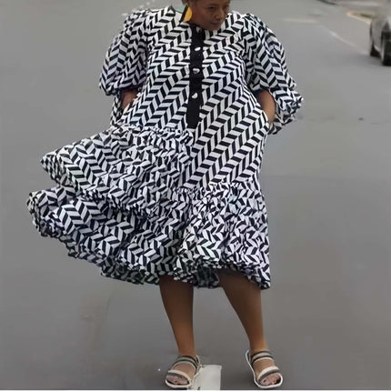 Plus size geometric midi dress with puff sleeves, black and white diagonal pattern