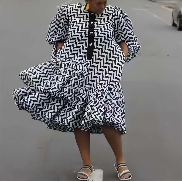 Plus size geometric midi dress with puff sleeves, black and white diagonal pattern