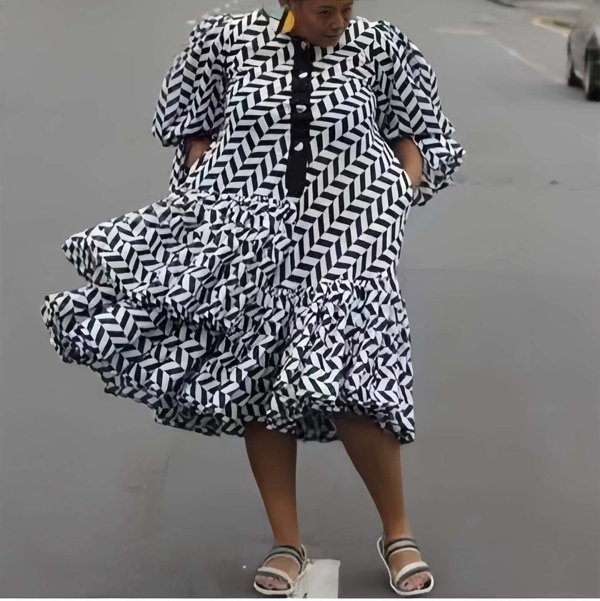 Plus size geometric midi dress with puff sleeves, black and white diagonal pattern