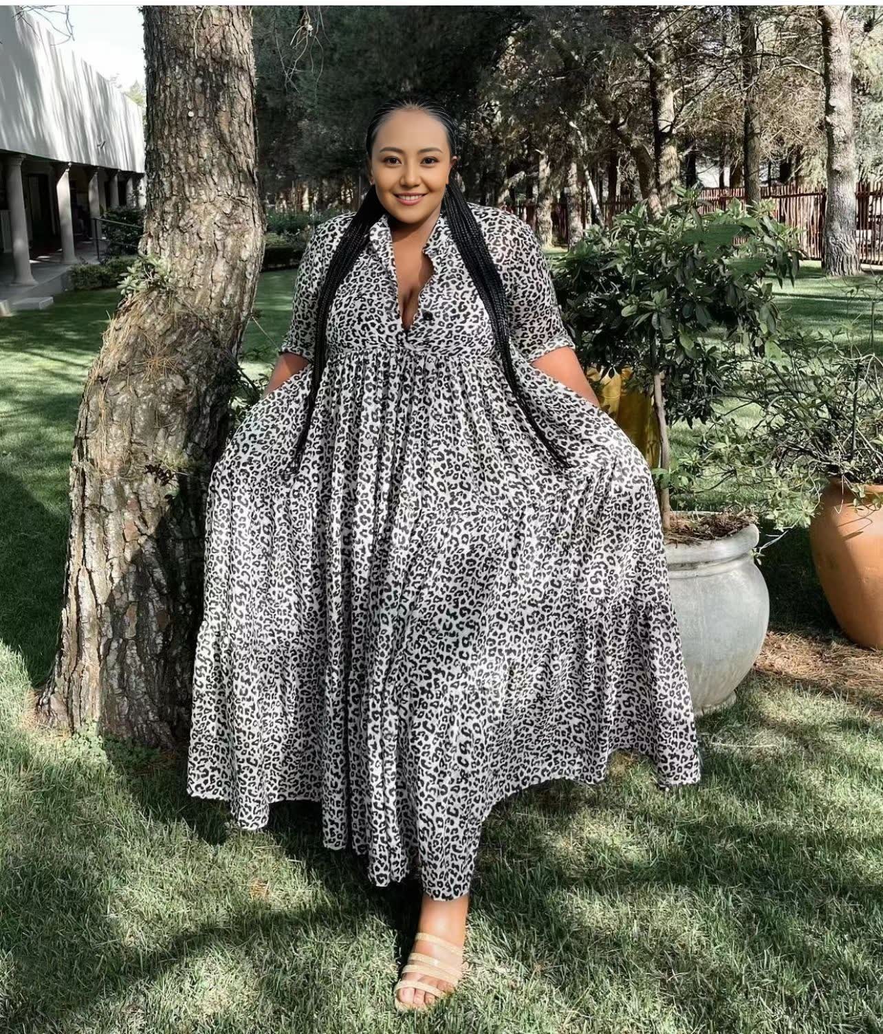 Animal print maxi dress in black-and-white with V-neck, three-quarter sleeves, tiered skirt