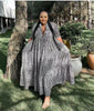 Animal print maxi dress in black-and-white with V-neck, three-quarter sleeves, tiered skirt