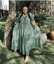 Animal print maxi dress in green with V-neck, three-quarter sleeves, and tiered skirt