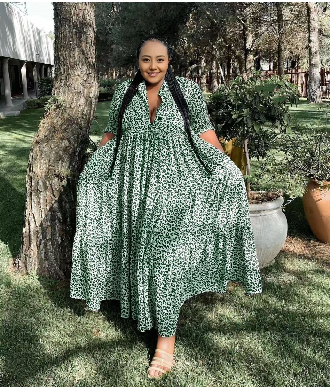 Animal print maxi dress in green with V-neck, three-quarter sleeves, and tiered skirt