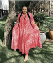Animal print maxi dress in red with V-neck, three-quarter sleeves, and tiered skirt