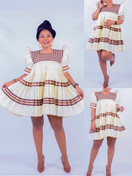 Cream mini dress with puff sleeves, ruffled pleats, and striped bodice