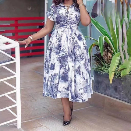 Tropical print midi dress with belted waist, white base and blue floral leaves, fit-and-flare
