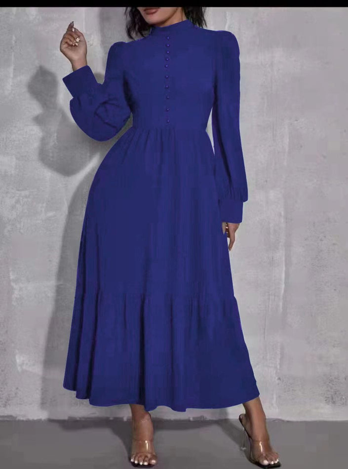 Blue midi dress with puff sleeves, tiered skirt, and button front