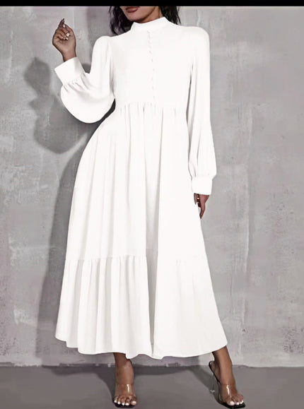 White midi dress with puff sleeves, tiered skirt, and button front