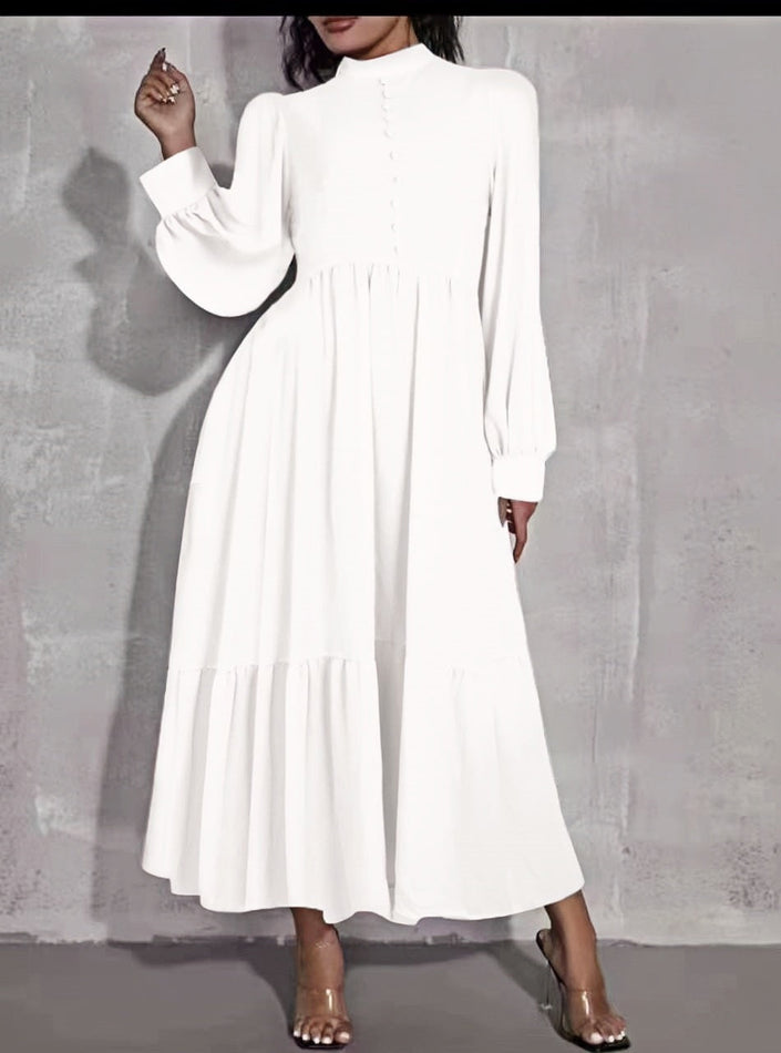 White midi dress with puff sleeves, tiered skirt, and button front