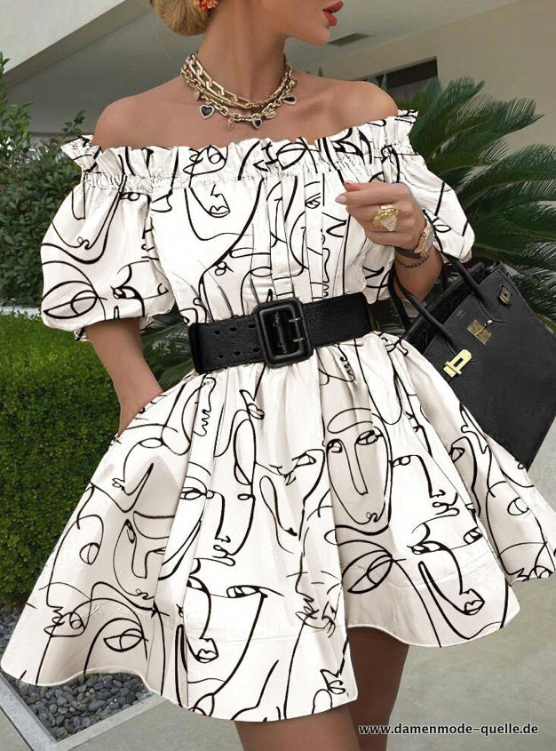 White off-shoulder puff-sleeve dress with black abstract line print and black belt