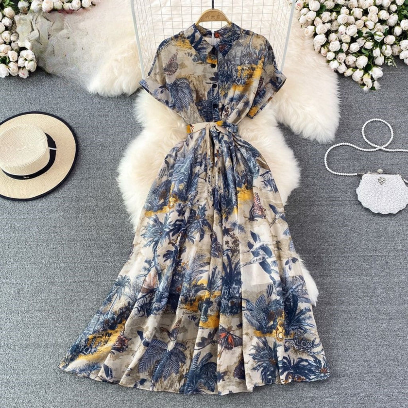 Printed midi dress with tie waist and short sleeves, blue and yellow floral pattern