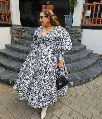 Geometric midi dress with puff sleeves, V-neck, black-and-white abstract pattern
