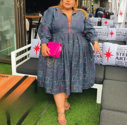 Blue patterned midi dress with puff sleeves and zip-front bodice