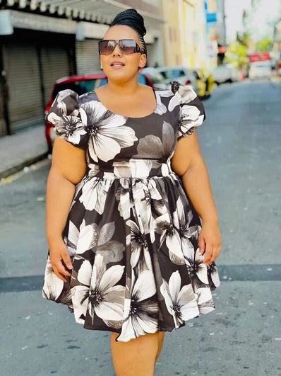 Black and white floral puff-sleeve dress with gathered waist and tie belt